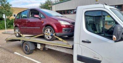 c-max on back of recovery vehicle from a repairer back to a dealer
